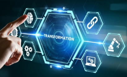 Finger touching digital screen with the word "transformation" centered in hexagon that is centered in the screen